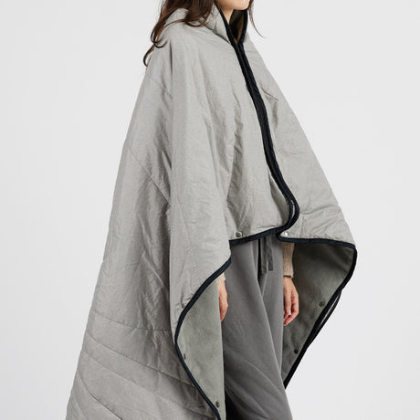 A women draping Z-Walk Rechargeable Heated Blanket