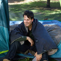 A man sitting in a tent