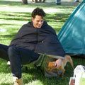 A man sitting on camping chair