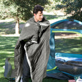 a man snuggling with cordless heated blanket